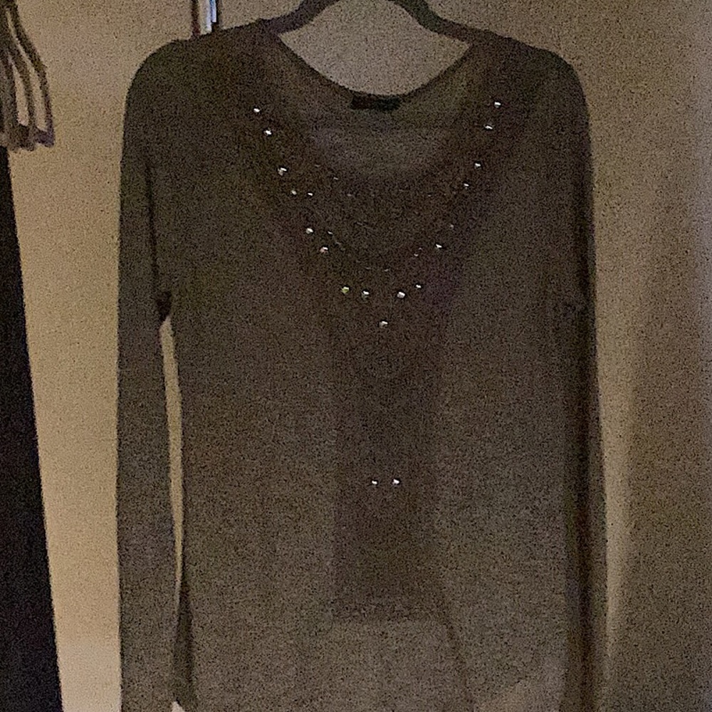 Enhanced with bugle beads and tacks.